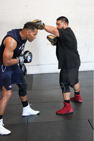 Robert and Isaiah working the mitts at Rebel One